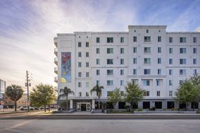 Tampa apartment for rent - a large white building with a mural on the side of it