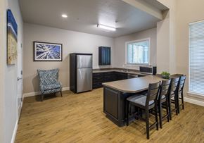 Tampa apartment for rent - A kitchen with a dining table and chairs.