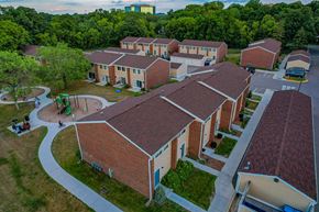 Minnetonka townhouse for rent - an aerial view of a cluster of buildings and a playground