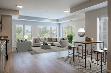 Hopkins apartment for rent - A modern living room with a large sectional sofa and a coffee table.