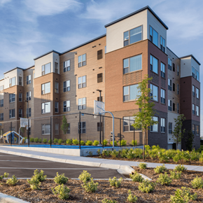Hopkins apartment for rent - A modern apartment building with a playground in front.