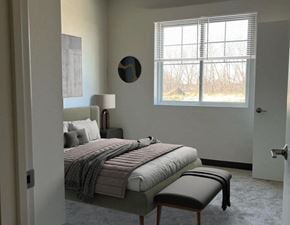 Windom apartment for rent - a bedroom with a bed and a window