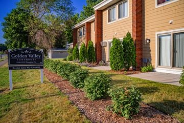 Golden Valley townhouse for rent - the residences at golden valley apartments sign in front of building