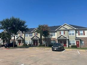 Pflugerville apartment for rent - an empty parking lot in front of an apartment building