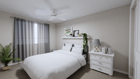 Ellendale apartment for rent - A white bedroom with a bed, nightstand, and a plant.