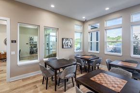 Ocala apartment for rent - A dining room with a chess board on the table.