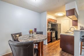 Universal City apartment for rent - a kitchen and dining room with a table and chairs