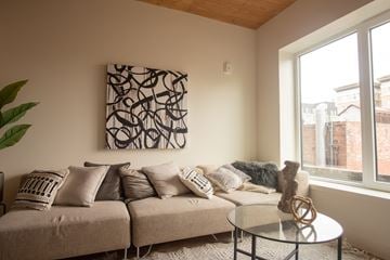 Oakland apartment for rent - a living room with a couch and a coffee table