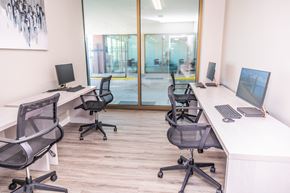 New Orleans apartment for rent - two desks with computers and chairs in an office