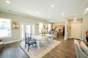 Tifton apartment for rent - a dining room with a white table and chairs