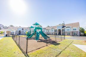 Tifton apartment for rent - the preserve at ballantyne commons playground with play equipment and apartments in the background