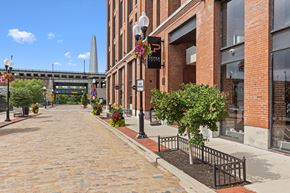 St. Louis apartment for rent - A brick building with a sign that says Pepper on it.