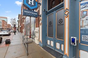 St. Louis apartment for rent - A blue and white sign for Hoffman Lofts is displayed on a building.
