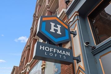 St. Louis apartment for rent - A sign for Hoffman Lofts is displayed on a building.