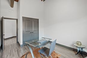 St. Louis apartment for rent - a dining room with a glass table and chairs