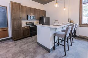 St. Louis apartment for rent - a kitchen with a island and a table with chairs