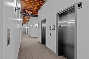 St. Louis apartment for rent - A long hallway with elevators on the right side.
