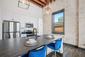 St. Louis apartment for rent - a kitchen with a counter top and a stainless steel refrigerator