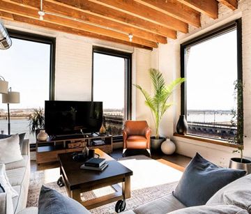 St. Louis apartment for rent - a living room with a couch and a tv     and a window