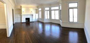 San Francisco apartment for rent - an empty living room with wood floors and a fireplace