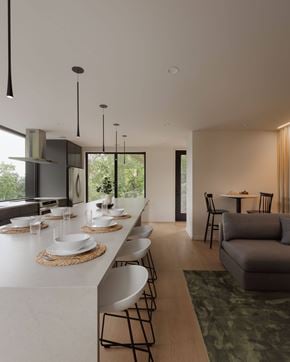 Saint Paul apartment for rent - A modern kitchen with a long white counter and chairs.