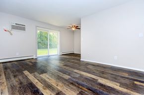 Willoughby apartment for rent - a living room with hardwood floors and a ceiling fan
