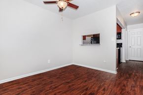 Eastlake apartment for rent - a living room with hardwood floors and a ceiling fan