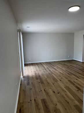 Columbus apartment for rent - A room with wooden flooring and white walls.