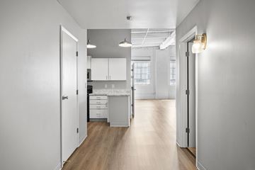 Cleveland apartment for rent - A kitchen with white cabinets and a wooden floor.