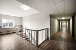 Brook Park apartment for rent - the upstairs hallway of a building with stairs and a window