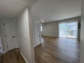 Columbus apartment for rent - A room with wooden floors and white walls.