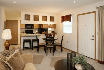 Canal Winchester apartment for rent - A well-lit living room with a dining table and chairs.