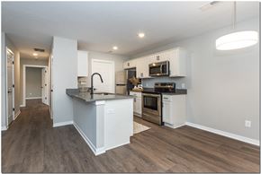 North Ridgeville apartment for rent - a kitchen with white cabinets and a counter top