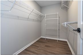 North Ridgeville apartment for rent - a spacious walk in closet with a large white closet and a ladder in the corner