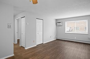 Cleveland apartment for rent - the living room of an apartment with wood flooring and a window