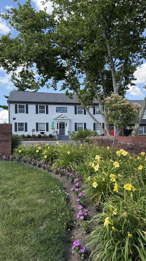 Columbus apartment for rent - Beautiful flower garden with yellow and purple blooms at The Vale at Walnut Creek Apartments, Columbus, OH 43232