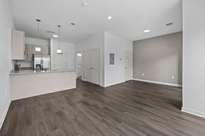 Cleveland apartment for rent - A spacious room with wood flooring and white walls. at The Lumos Apartments, Ohio