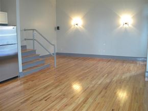 Cleveland apartment for rent - a large room with a wooden floor and stairs