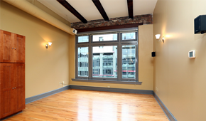 Cleveland apartment for rent - an empty room with a large window and wooden floors
