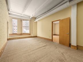 Cleveland apartment for rent - an empty room with two windows and a door