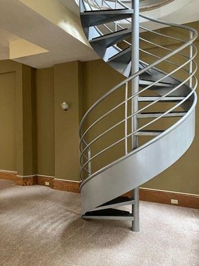 Cleveland apartment for rent - a spiral staircase in a room with green walls