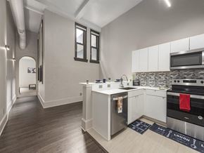Cleveland apartment for rent - a kitchen with a stove top oven next to a sink