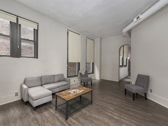 Cleveland apartment for rent - a living room with a couch chairs and a coffee table