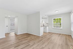 Columbus apartment for rent - A room with wooden floors and white walls.