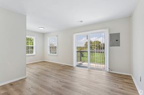 Columbus apartment for rent - A room with a sliding glass door leading to a balcony.