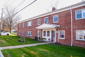 Lyndhurst apartment for rent - the front of a brick building with a sidewalk and grass