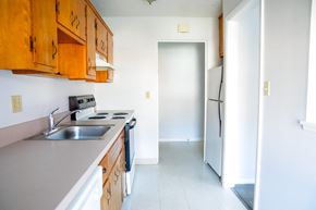 Lyndhurst apartment for rent - an empty kitchen with a sink and a refrigerator