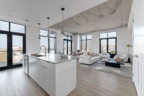 Cleveland apartment for rent - a kitchen island in the middle of a living room