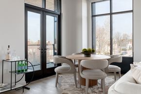 Cleveland apartment for rent - a living room with a table and chairs and a large window