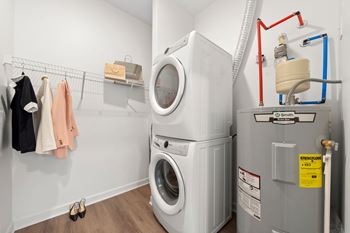 A washing machine and dryer in a small laundry room.